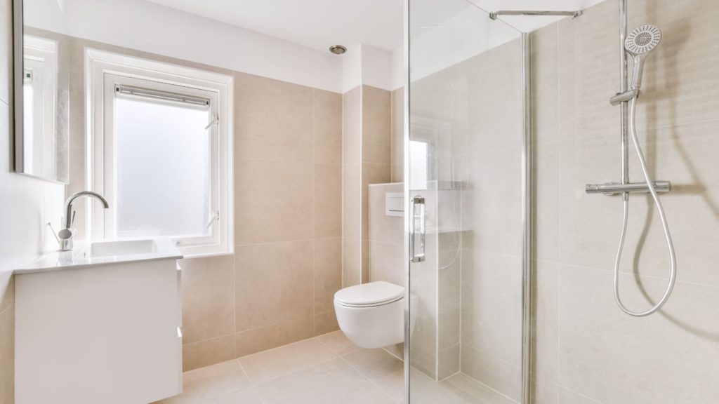 Bathroom style with floating toilet, vanity, and a shower