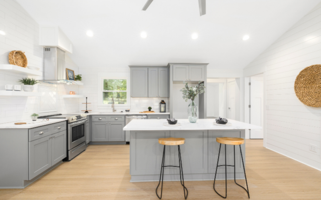 Elegant kitchen with gray cabinets and white tops