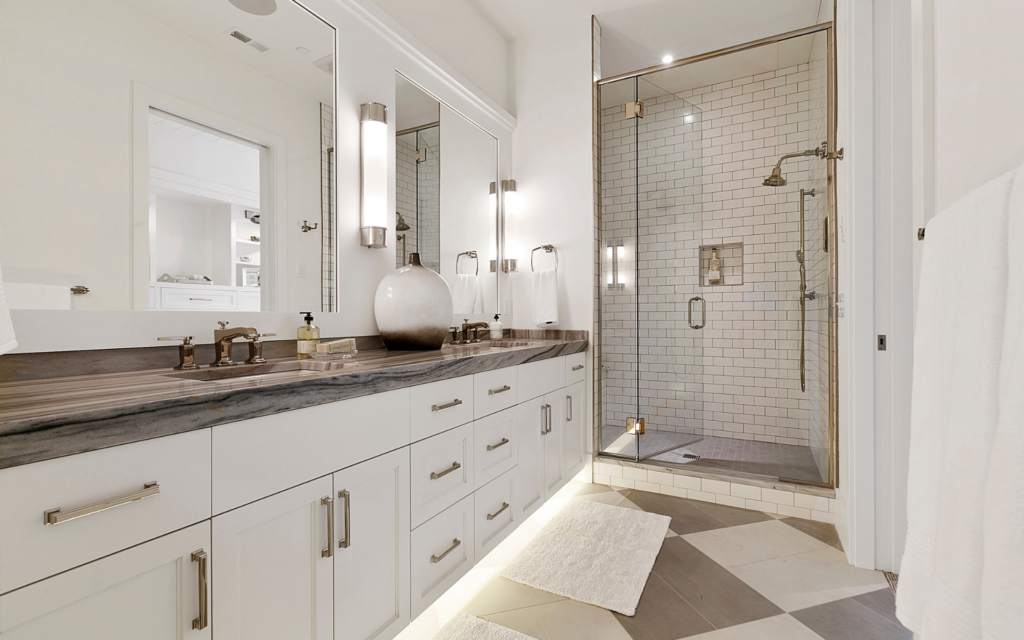 Modern bathroom design with white double sink vanity and a shower