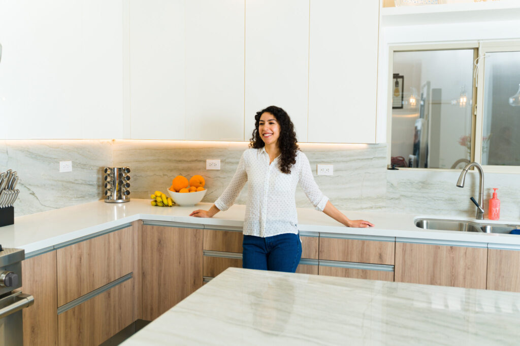 Woman enjoying her beautiful luxury granite with Top Kitchen and Bathroom Remodeling Company in Washington DC